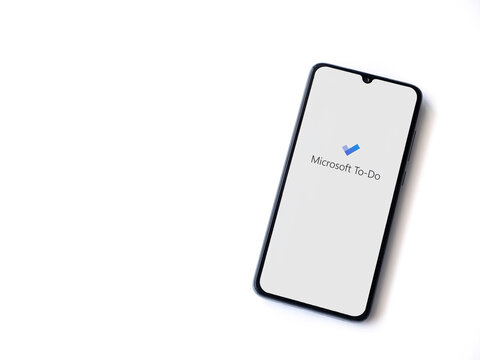 Lod, Israel - July 8, 2020: Microsoft To Do app launch screen with logo on the display of a black mobile smartphone isolated on white background. Top view flat lay with copy space.
