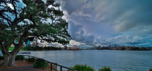 Fototapeta premium Sydney Harbour in NSW Australia on cloudy spring afternoon dark cloudy skies