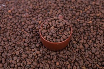 Cup of coffee on the coffee beans background