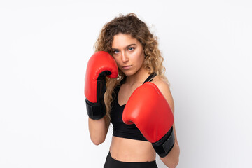 Young sport woman isolated on white background with boxing gloves