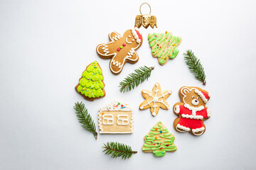 Christmas round composition made of winter decorations and gingerbread on white background. Christmas concept. Flat lay, top view.