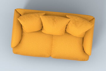 Yellow couch with pillows on studio grey background.