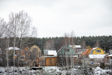 small village with colorful houses covered with snow