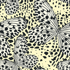 Seamless vector multicolor butterflies pattern. Butterfly on leopard print. Trendy animal motif wallpaper. Fashionable background for fabric, textile, design, banner, cover, web etc.