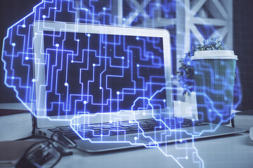 Double exposure of work space with computer and human brain drawing hologram. Brainstorm concept.