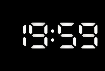 Real white led digital clock on black background