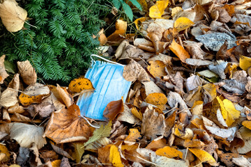 Face mask on the ground as trash