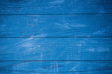 Vintage blue wood background texture with knots and nail holes. Old painted wood wall. Blue abstract background.