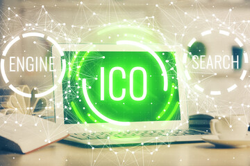 Multi exposure of blockchain and crypto economy theme hologram and table with computer background....
