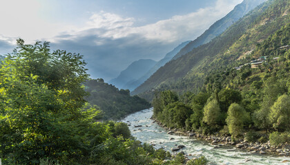 Fototapeta na wymiar River running in the Tirthan Valley