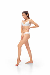 Beautiful female model isolated on white background. Beauty, cosmetics, spa, depilation, diet and treatment and fitness concept. Fit and sportive, sensual body with well-kept skin in underwear.