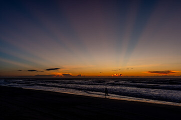 Fototapeta na wymiar Morning Rays Over the Sea