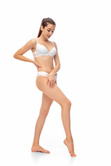 Beautiful female model isolated on white background. Beauty, cosmetics, spa, depilation, diet and treatment and fitness concept. Fit and sportive, sensual body with well-kept skin in underwear.