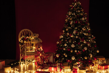 Light garlands of Christmas tree decor presents new year night interior