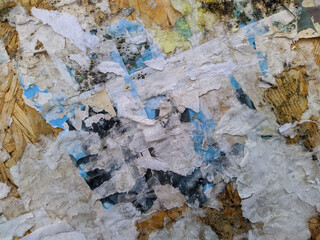 old and empty public bulletin board with the remains of torn papers