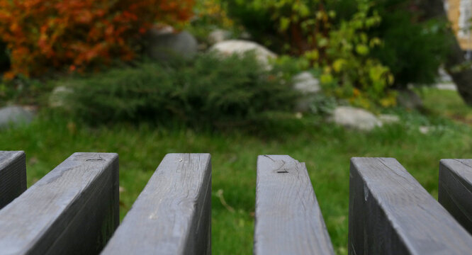 Parallel plank bench element on grass background