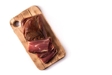 Dried and smoked meat isolated on white background. Top view. Copy space	