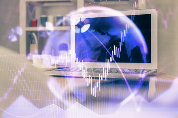 Financial market graph hologram and personal computer on background. Multi exposure. Concept of forex.