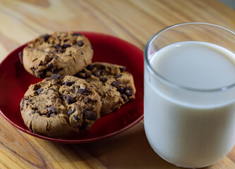 Chocolate Chip Cookies on red plate and Milk