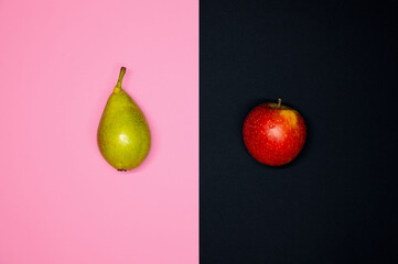Flat Lay Of A Pear And An Apple. Social Theme Of inequality, Imbalance and discrimination of...