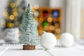 Fototapeta na wymiar Beautiful multi-colored Christmas decorations on a light wooden table