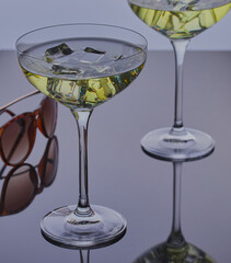 Cocktails with a pair of sunglasses.