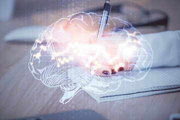 Multi exposure of woman's writing hand on background with brain hologram. Concept of brainstorming.
