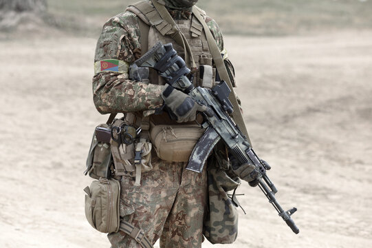 Soldier with assault rifle and flag of Eritrea on military uniform. Collage.