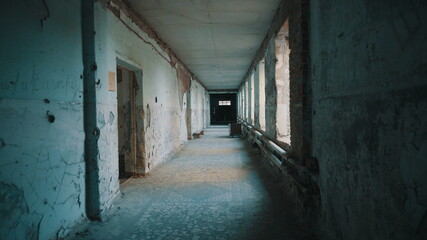 Fototapeta na wymiar Destroyed school in Beslan after the terrorist attack. Old empty school corridors