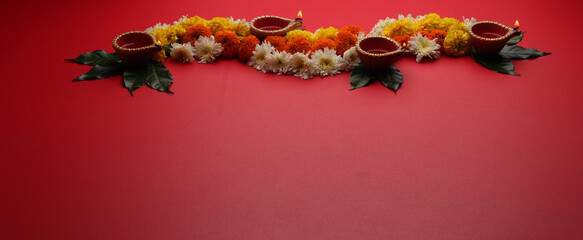 Flower Rangoli for Diwali or Pongal Festival made using Marigold or Zendu flowers and Clay Oil Lamp...