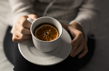 Girl holding a cup of tea