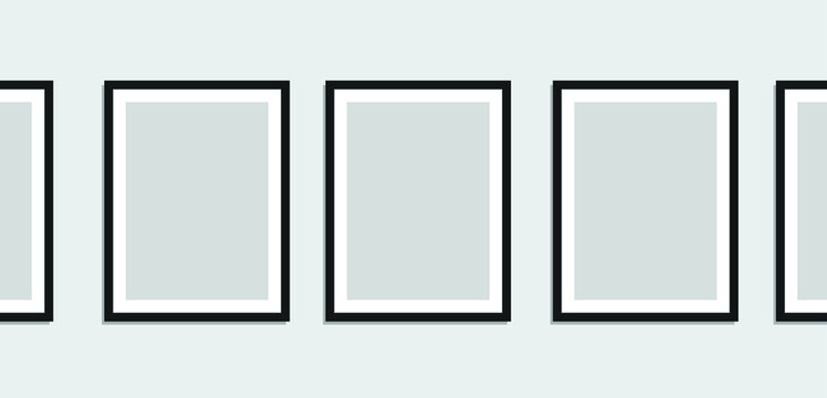 A Series of Blank Picture Frames on a Grey Colored Wall