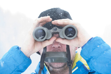 a person looking through binoculars