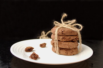 Fototapeta na wymiar homemade chocolate chip cookies on a plate with crumbs