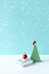 Christmas tree with present and balls. Vertical.