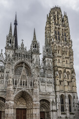 Fototapeta na wymiar Fragment of (Cathedrale de Notre-Dame, 1202 - 1880). Rouen in northern France on River Seine - capital of Haute-Normandie (Upper Normandy) region and historic capital city of Normandy.