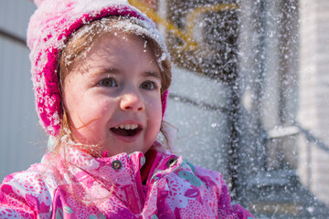 emotional portrait of cute little girl in winter
