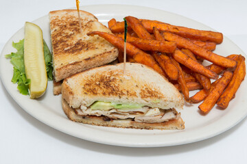 Toasted Turkey Sandwich with Avocado and Sweet Potato Fries. 