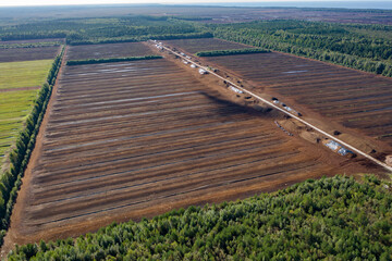 Aerial view of peat harvesting field. Peat extraction