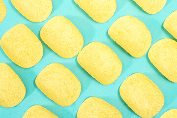 pattern of potato chips isolated on blue background