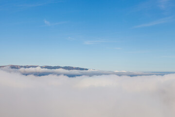 Mountain top above the clouds