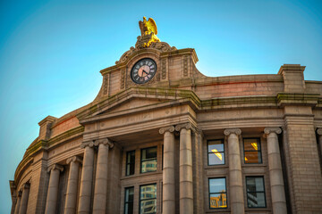 The clock and facade of South Station in downtown Boston