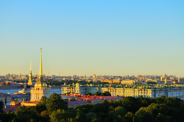 Fototapeta na wymiar Panorama. Roofs of St. Petersburg. Bird's eye view of the Winter Palace and the spire of the Admiralty. Russia, Saint Petersburg, 08/17/2020