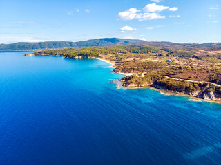 Naklejka premium Church and sea with beach and mountains in Nea Roda