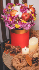 Autumn bouquet of flowers and apples. Autumn bright background with apples, chrysontema, dry...