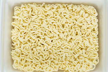 instant noodles in rectangle plastic plate, top view