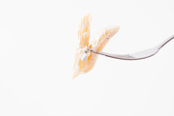 Pasta with blue cheese and cream sauce eaten with a fork