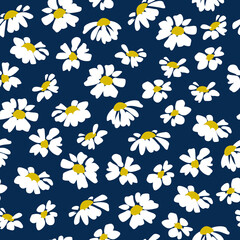 Seamless pattern. Chamomile flowers on a blue background.