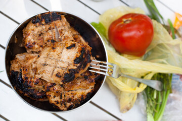 barbeque grilled meat with ripe fresh red tomato