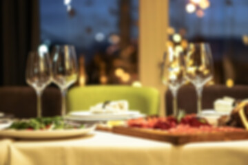 Nicely served New Year's table in the restaurant. Christmas night in a cafe or at home. Stock photo for design